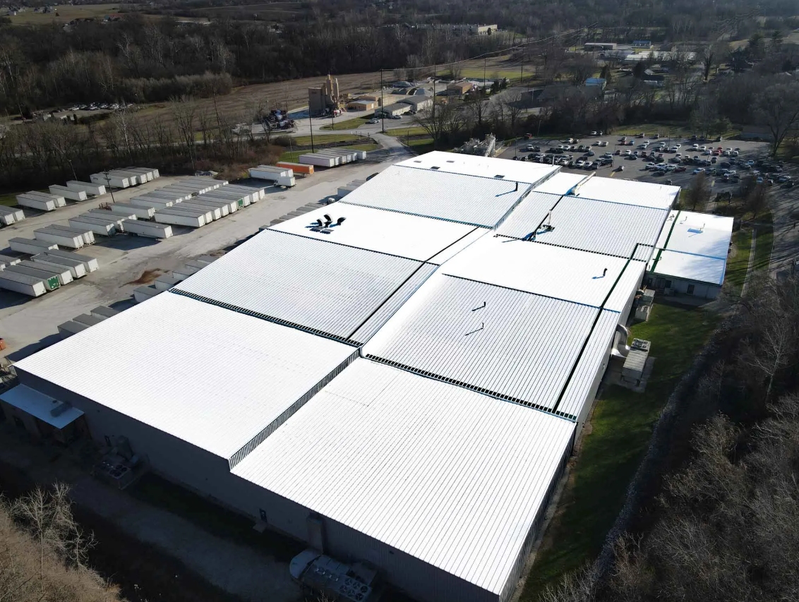 Aerial view of a manufacturing plant with a restored roof