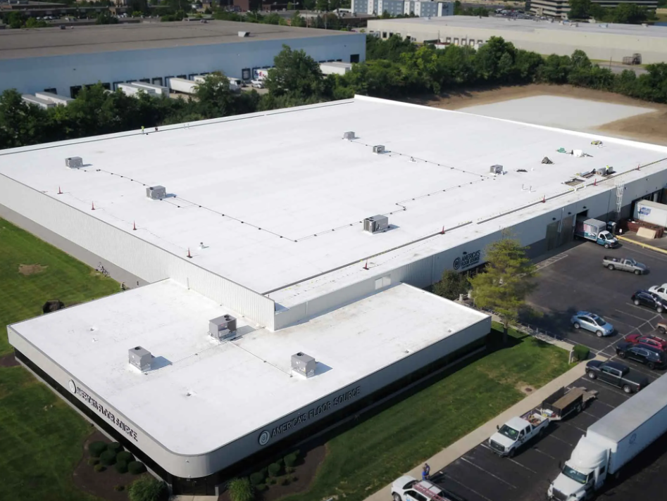 Aerial view of Seamless Roofings roof recovery at a distribution center