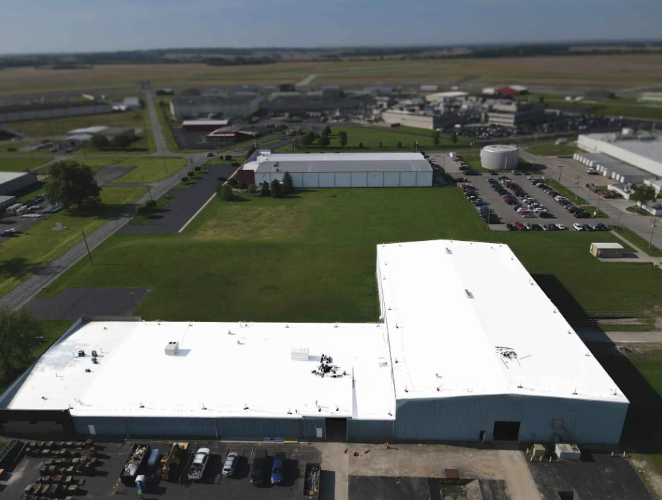 Aerial view of a manufacturing plant with a metal roof retrofit
