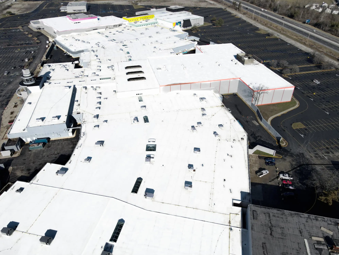 Aerial view of a retail facility with a completed roof repair